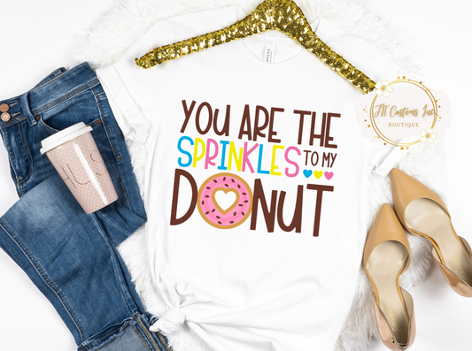 You are the sprinkles to my donut tee, perfect tshirt in time for valentines day or just everyday wear. white tshirt, with hearts and blue, pink, yellow colors